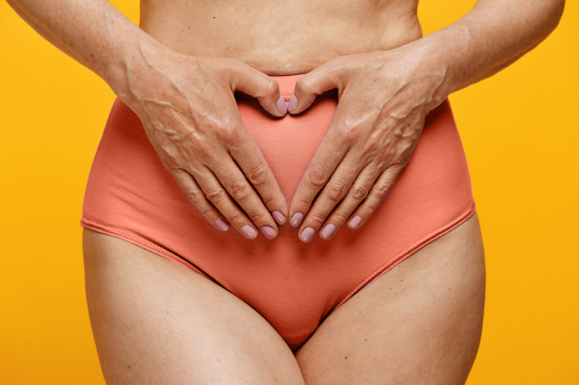 Person with hand positioned in triangle shape